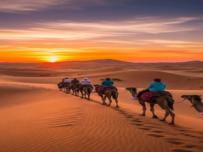Camel caravan crossing the Sahara dunes